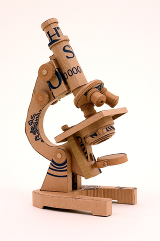 Illustration for article titled Full-Size Cardboard Aston Martin for Papier-Mâché Bonds